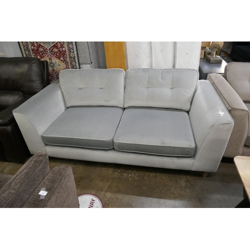 1432 - A pewter velvet three seater sofa