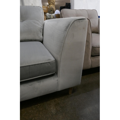 1432 - A pewter velvet three seater sofa