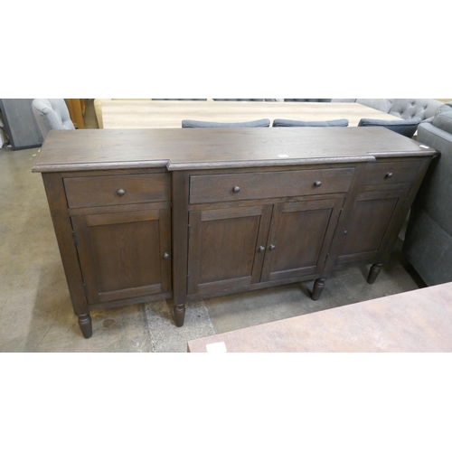 1449 - A four door dark oak sideboard