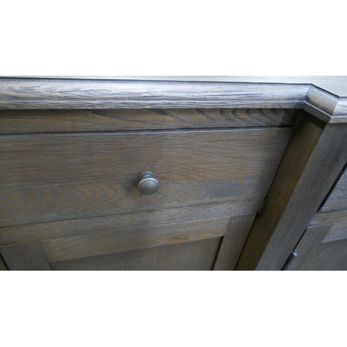 1449 - A four door dark oak sideboard