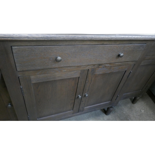 1449 - A four door dark oak sideboard