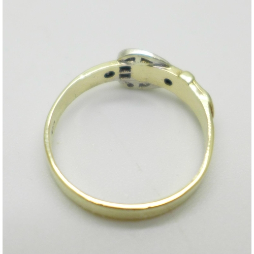 1008 - A 9ct gold buckle ring set with eight diamonds, 1.8g, M