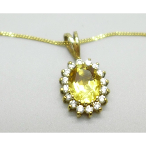 1011 - A 9ct gold, citrine and zircon pendant and chain with citrine earrings, 4.9g