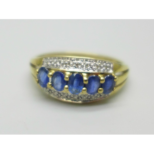 1016 - A 9ct gold, sapphire and diamond three row ring, 2.5g, S/T, with box