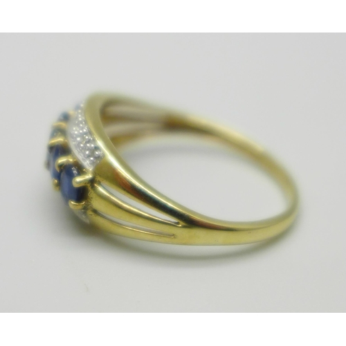 1016 - A 9ct gold, sapphire and diamond three row ring, 2.5g, S/T, with box