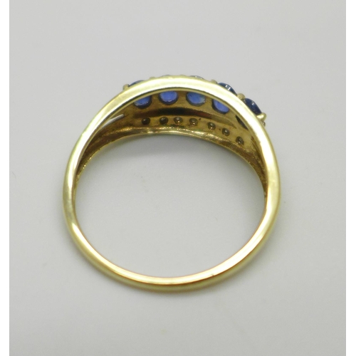 1016 - A 9ct gold, sapphire and diamond three row ring, 2.5g, S/T, with box