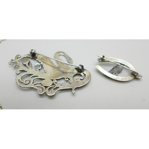 1018 - A silver and enamelled bird brooch, Birmingham 1916, a 925 silver stylised swan brooch and a silver ... 