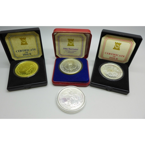 1021 - A 2012 Britannia One Ounce Fine Silver 2 Pounds coin and three Pobjoy Mint Isle of Man commemorative... 