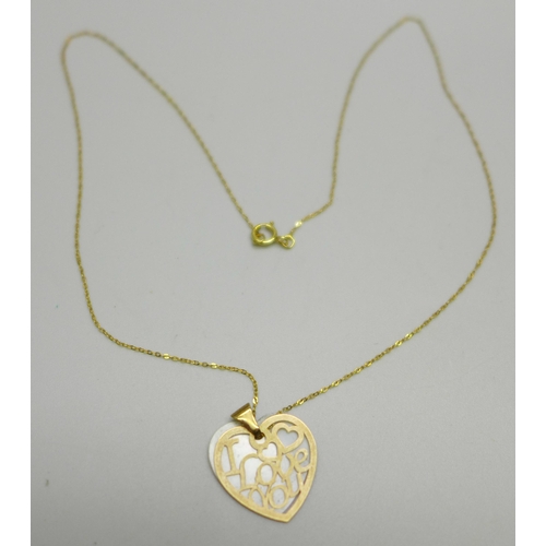 1031 - A 9ct gold mounted pendant on a fine 9ct gold chain, chain 38cm