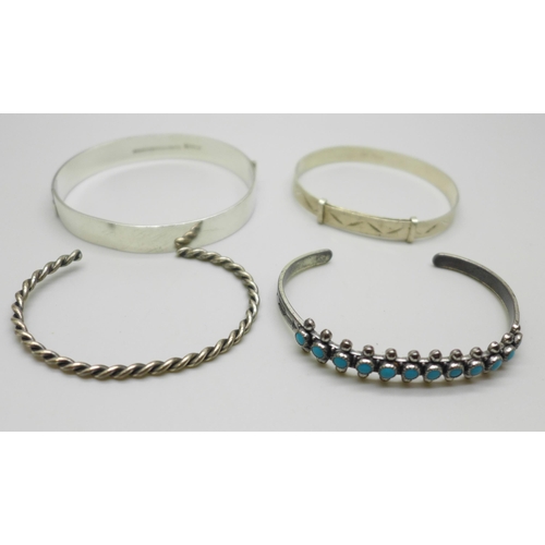 1033 - Two silver bangles, 30g, one silver plated bangle set with turquoise colour stones and one unmarked ... 