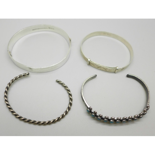 1033 - Two silver bangles, 30g, one silver plated bangle set with turquoise colour stones and one unmarked ... 