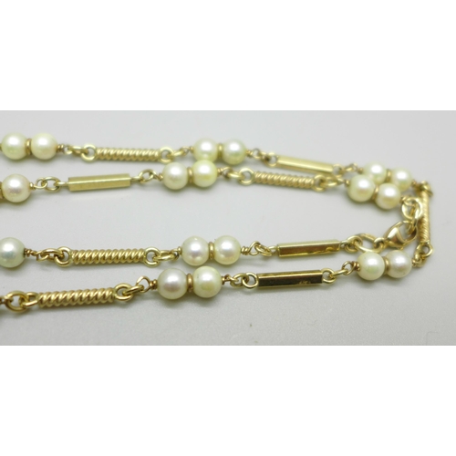 1035 - A vintage 9ct gold and pearl necklace, 20g, approximately 68cm