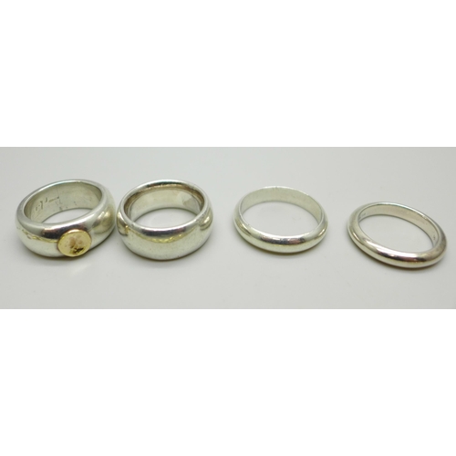 1037 - Three silver rings, one with a 14ct gold applied detail (marked 585), a white metal ring and a plate... 