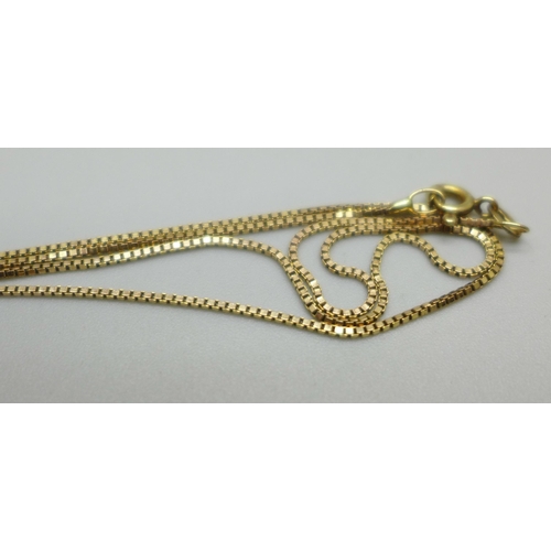 1049 - A yellow metal diamond simulant pendant on a 9ct gold chain, 2.1g, 41.5cm