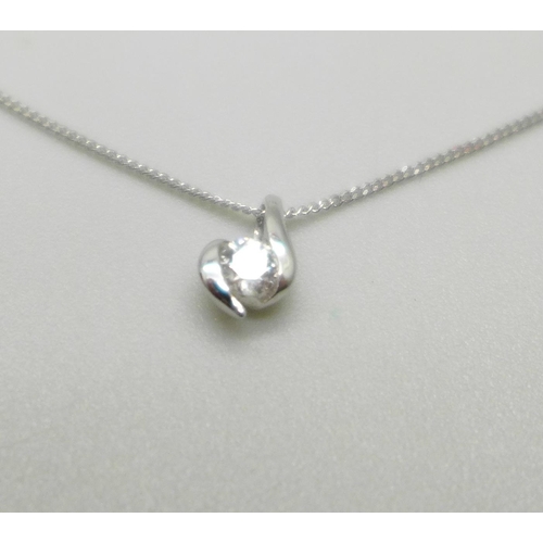 1050A - A 9ct white gold and diamond pendant on a fine 9ct white gold chain, 0.9g, chain 41cm, with Canadian... 