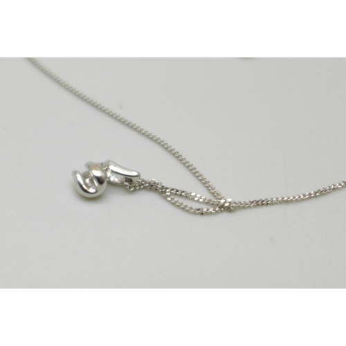 1050A - A 9ct white gold and diamond pendant on a fine 9ct white gold chain, 0.9g, chain 41cm, with Canadian... 