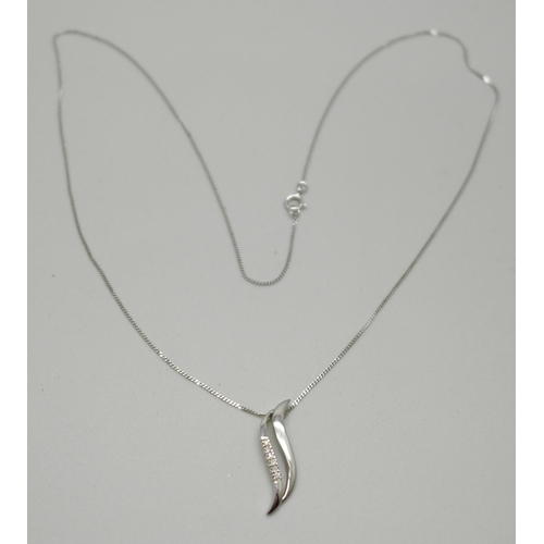 1051 - An 9ct white gold pendant set with six diamonds, on a 9ct gold chain, 1.5g