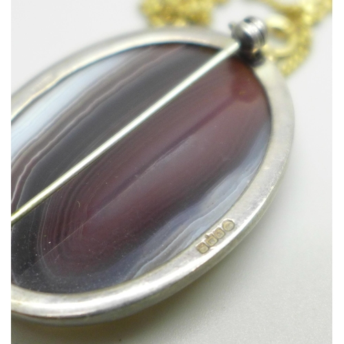 1065 - A gilt metal mounted agate pendant, a silver and agate brooch by Malcolm Gray, a moss agate brooch, ... 