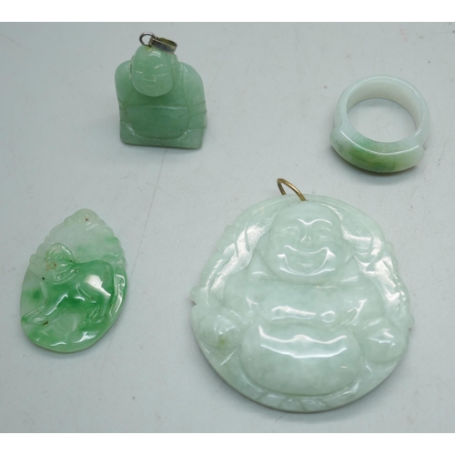 1121 - An ice green jade carved laughing Buddha pendant, a jade ring, a small carved jade ram pendant and a... 