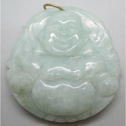 1121 - An ice green jade carved laughing Buddha pendant, a jade ring, a small carved jade ram pendant and a... 