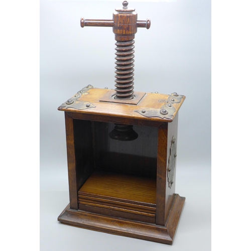 601 - An oak flower press, a Karelian birch cigarette box and a wooden pocket watch box
