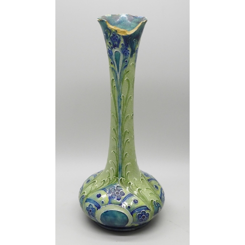 606 - An early William Moorcroft vase, made for Liberty & Co., rim a/f, 18cm