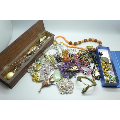 609 - Costume jewellery, a silver topped hat pin box with hat pins, Albert chain, etc.