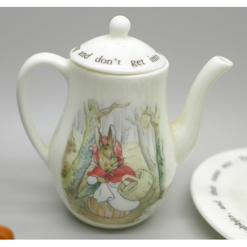 626 - A miniature Wedgwood eight piece Beatrix Potter tea set, cup a/f, with Peter Rabbit hair slide also ... 
