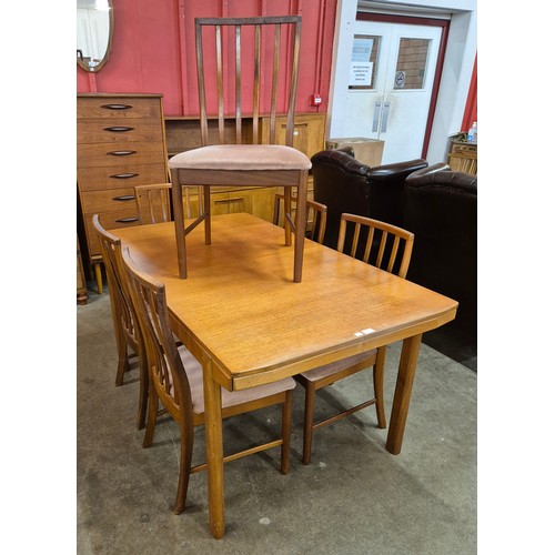 31 - A McIntosh teak extending T2 model dining table and six chairs