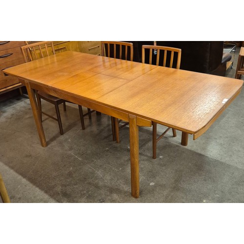 31 - A McIntosh teak extending T2 model dining table and six chairs