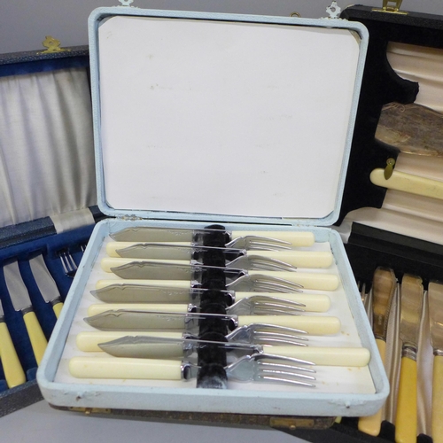 652 - Four sets of plated cutlery including one set of pastry knives and forks with silver collars