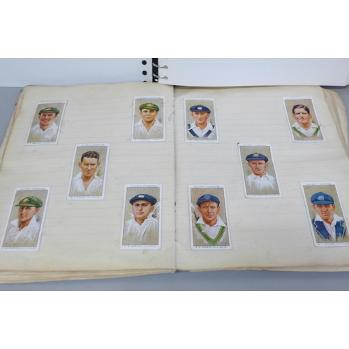 656 - A stamp album containing world stamps, a collection of vintage comic postcards and a notebook contai... 