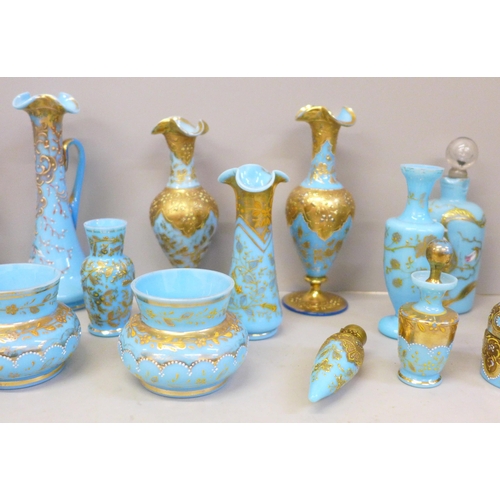 663 - French opaline sky blue glass and gilded scent bottles, vases, jug and pots, (21) (one scent bottle ... 