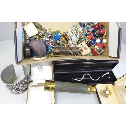 667 - A collection of vintage costume jewellery, a three draw antique brass pocket telescope, jewellery bo... 