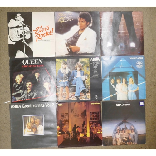 689 - A box of LP approximately 55 records; ABBA, Elvis Presley, Queen, Billy Joel, Level 42, etc.