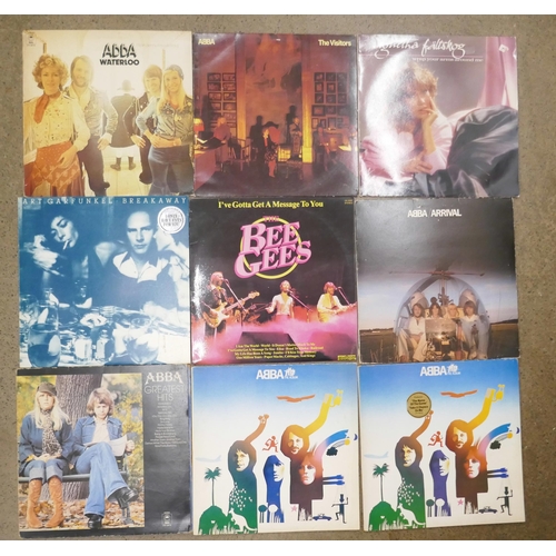 689 - A box of LP approximately 55 records; ABBA, Elvis Presley, Queen, Billy Joel, Level 42, etc.