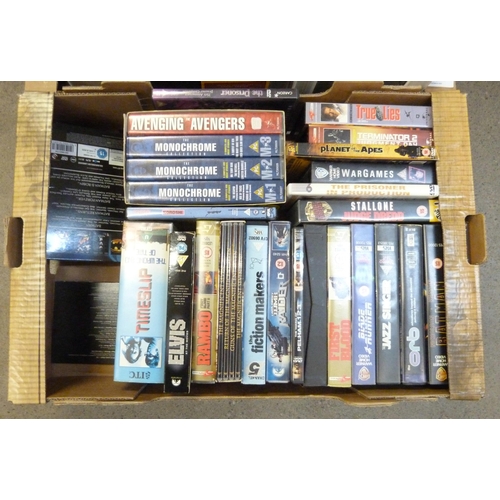 709 - Vintage VHS tapes including Cert. 18, Rambo, Blade Runner, Indiana Jones, etc., and a box of Space a... 