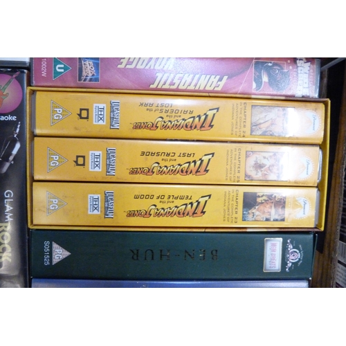 709 - Vintage VHS tapes including Cert. 18, Rambo, Blade Runner, Indiana Jones, etc., and a box of Space a... 