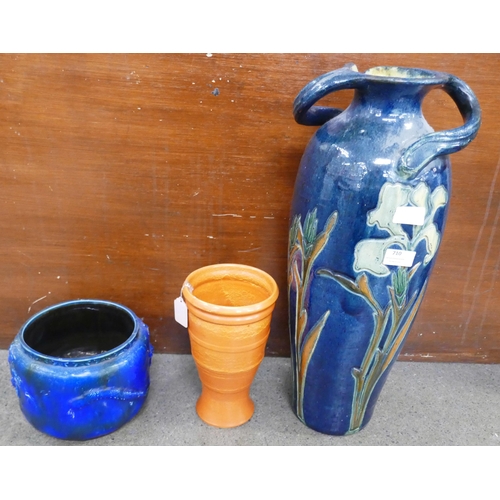 710 - A large Art Nouveau pottery vase, rim restored, a Bretby planter, restored and an orange Branham pot... 