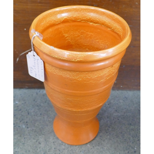 710 - A large Art Nouveau pottery vase, rim restored, a Bretby planter, restored and an orange Branham pot... 