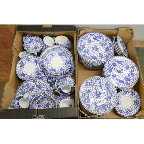 715 - A large collection of Noritake blue and white dinner and teawares, tea cups, coffee cups, soup bowls... 