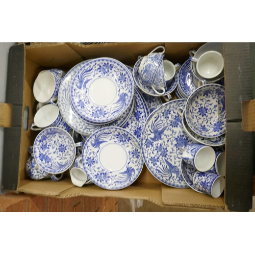 715 - A large collection of Noritake blue and white dinner and teawares, tea cups, coffee cups, soup bowls... 