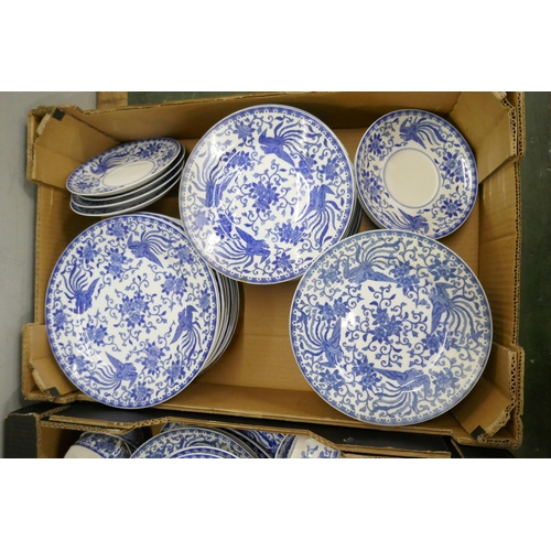 715 - A large collection of Noritake blue and white dinner and teawares, tea cups, coffee cups, soup bowls... 