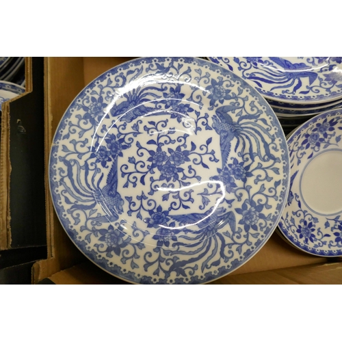 715 - A large collection of Noritake blue and white dinner and teawares, tea cups, coffee cups, soup bowls... 