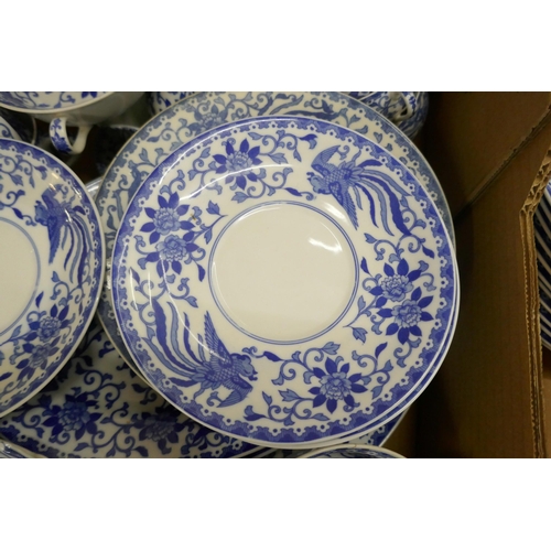 715 - A large collection of Noritake blue and white dinner and teawares, tea cups, coffee cups, soup bowls... 