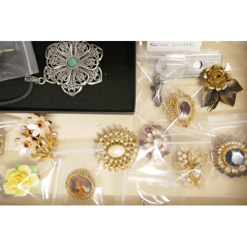 725 - A collection of costume jewellery and three lady's wristwatches, in a jewellery cabinet