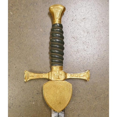 731 - A Wilkinson commemorative Liberator sword with leather and wire bound grip