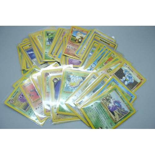 745 - Ninety vintage Pokemon cards, sets Fossil base set, Rocket, base set 2, Jungle, etc.