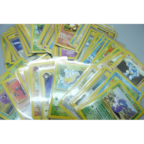 745 - Ninety vintage Pokemon cards, sets Fossil base set, Rocket, base set 2, Jungle, etc.