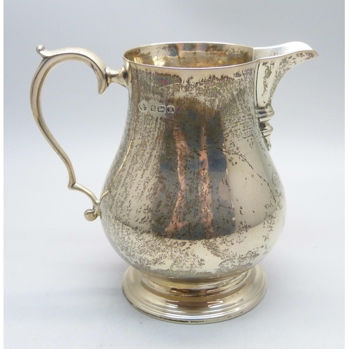 764 - A silver cream jug, Birmingham 1932, Adie Bros., 143g